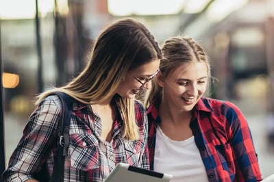 Two young women shopping online