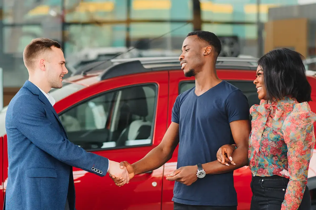 A young couple purchases their first car