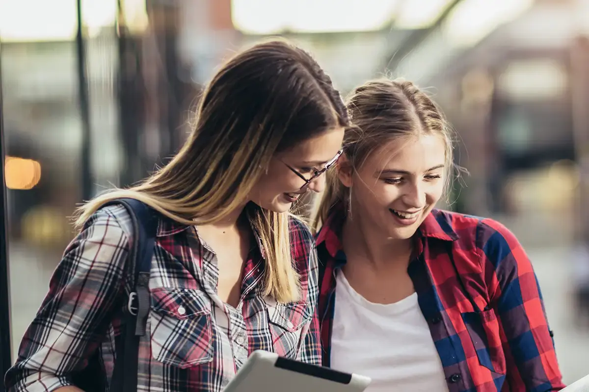 Two young women shopping online
